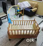 Wooden Baby Cot with electronic toy for sale