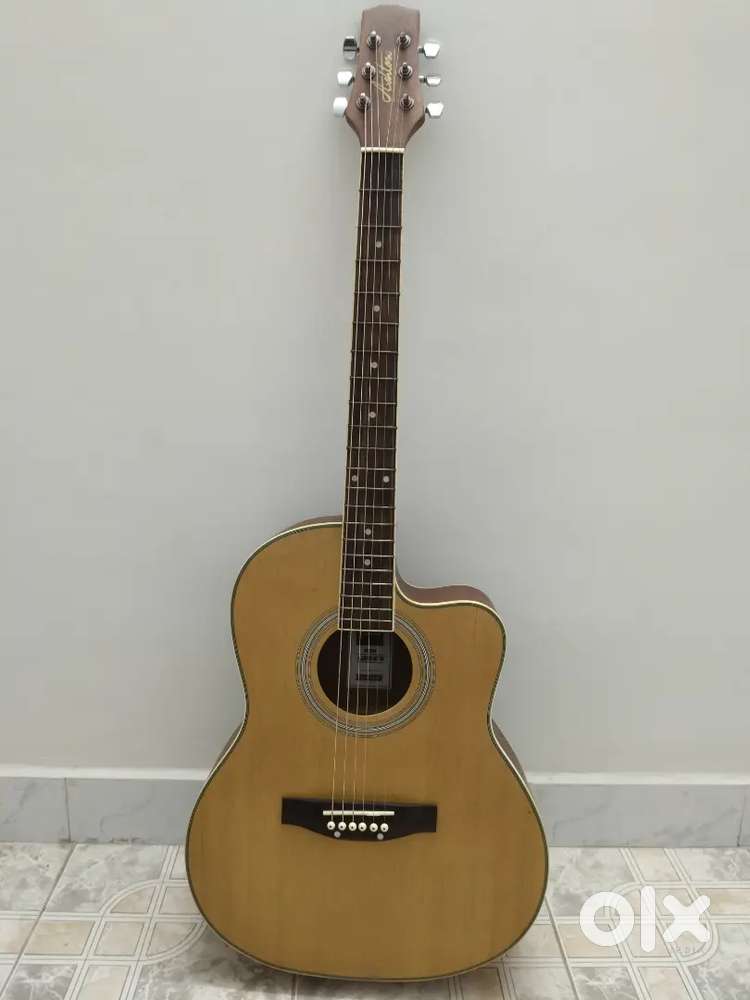 Guitar just 1 year old with excellant condition with guitar cover
