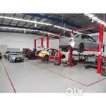 Senior and junior car mechanic