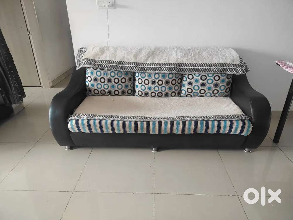Used sofa with cover and cushions
