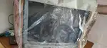 Aiwa TV with it's cover and stand