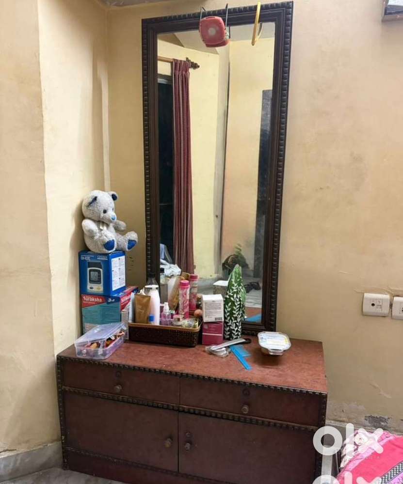 Dressing table with attached mirror