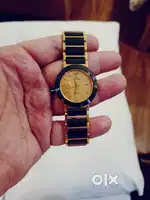 Elegangs green gold strap with date. Dial colour is wine.
