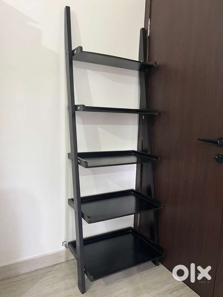 A Sheesham wood ladder shelf