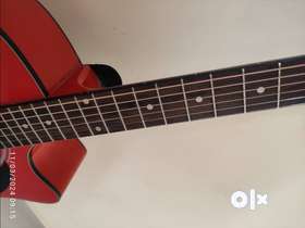 Orange color guitar in brand new condition