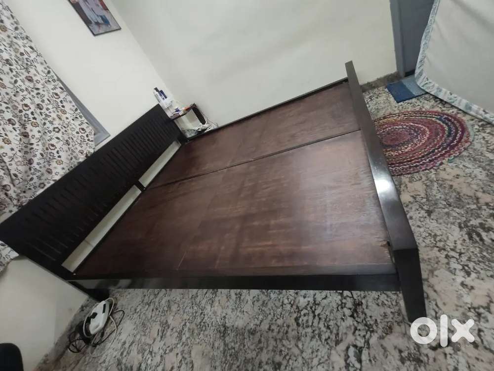 Walnut brown king size wooden bed mango wood fab india
Price 17000