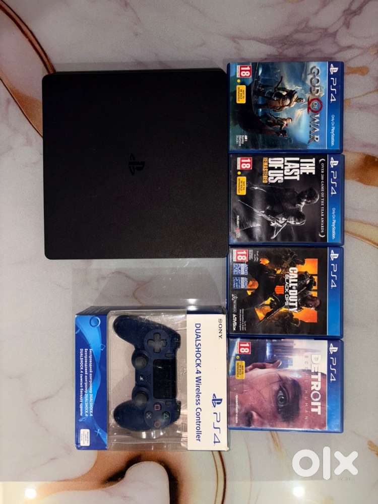 PS4 Slim 1TB with Dualshock 4 Midnight Blue Controller and 4 Games
