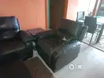 Three seater sofa with recliner and  a rocking chair