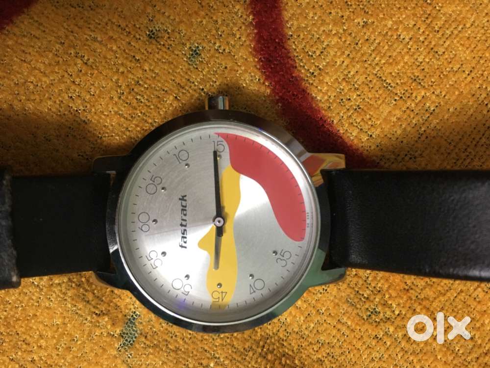Fastrack’s unique designer analog wristwatch with dual-tone (red & yel