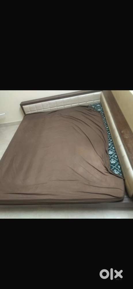 Wooden king size bed with side cushion