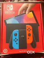 Nintendo Switch OLED 64 GB, Red and Blue