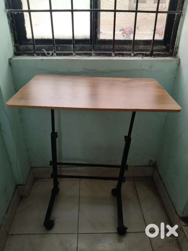 Adjustable bed-side table