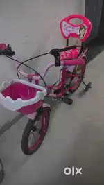 Pink Kids cycle with supporters