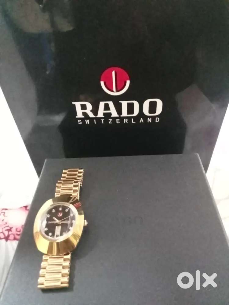 Original Rado Diastar black analogue watch golden steel strap
