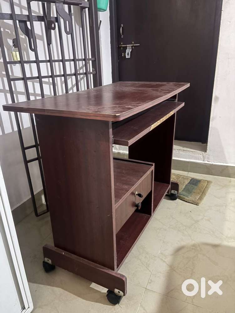 Computer table with keyboard drawer and lock