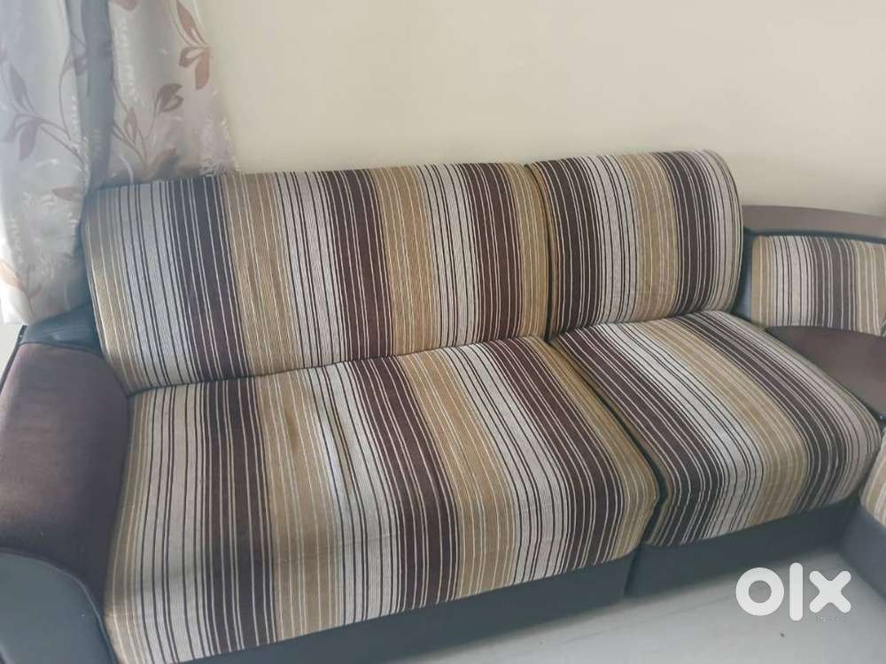 L-shaped sofa with center table