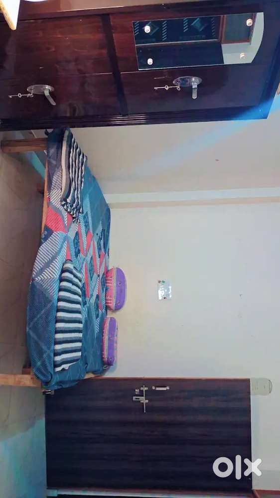 A full furnished room with attached balcony and washroom