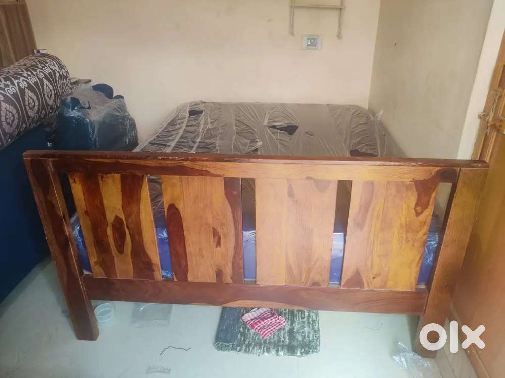 Wake fit mattress, Premium wood cot, Computer table, pooja cupboard.