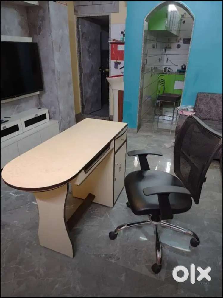 Computer table with revolving chair