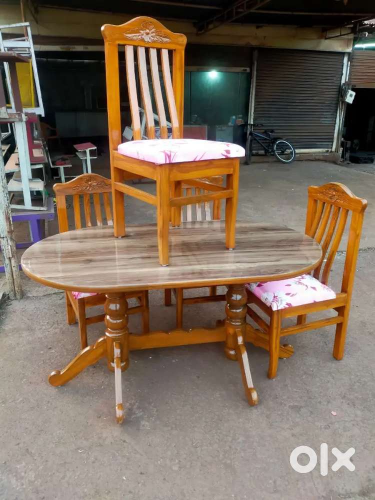 Curved dinning table with teak wood available in Starf Furniture