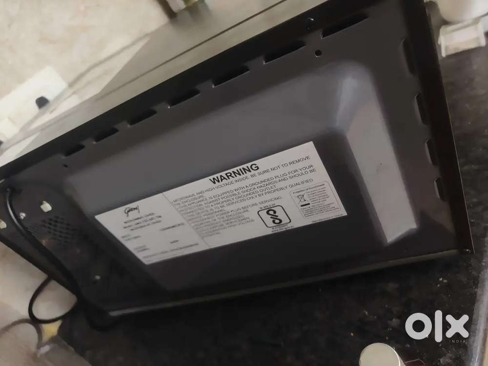 Godrej microwave and black decer oil radiator