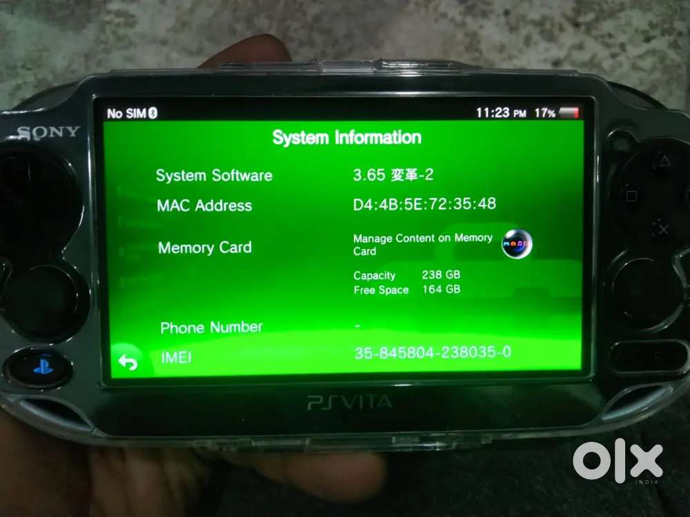 SONY PS VITA OLED 256GB MODEL WITH ORIGINAL CHARGER AND CARTRIDGES