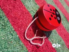 Experience the charm of Shimla with our handcrafted wooden yo-yo toy featuring a delightful ladybug ...