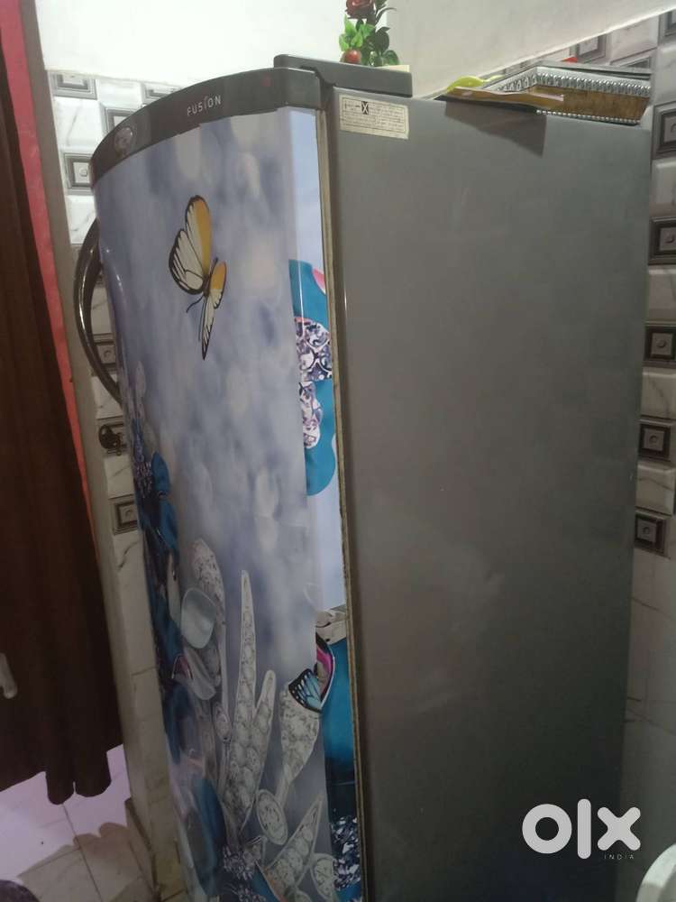 A fridge with  a frigde sticker on it