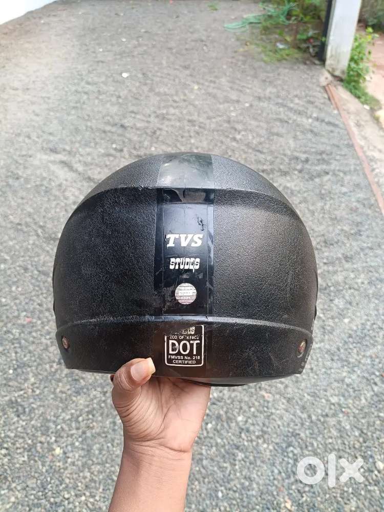 Black TVS Studds open-face (half-face) helmet. 