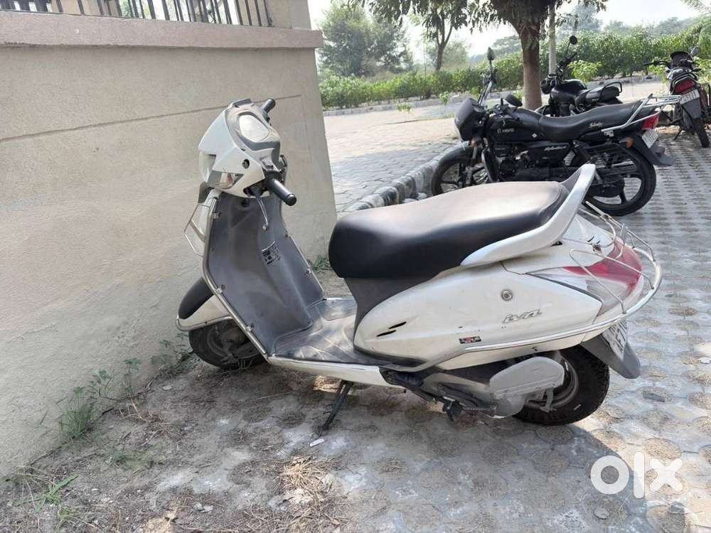 Activa 4G white Very less driven with guarantee Good condition