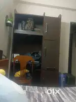 Wooden study table with storage cabinets