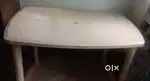A dining table,a very beautiful steel showcase ,and a door