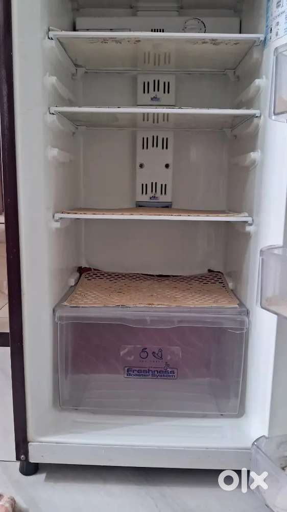 Double door whirlpool fridge in up to date running condition