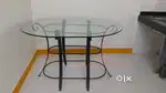 Wrought iron dining table with glass top