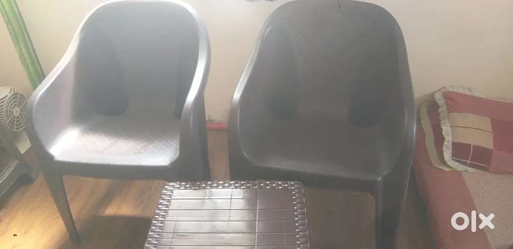 New chair 2 pic dark brown durable and tea table plastic.