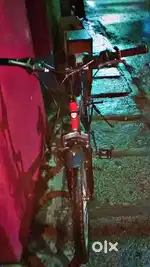 Bicycle in very good condition  black  and red   colour