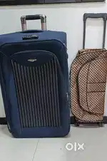 28inch blue suitcase with A small brown trolley bag wheels in it
