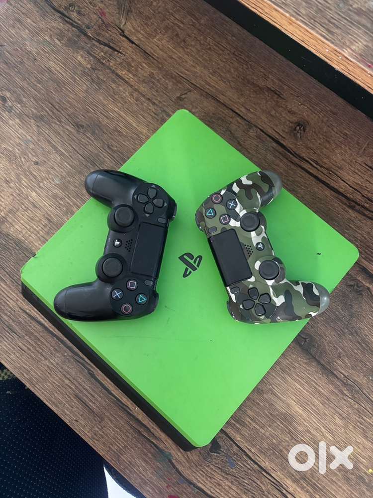 PS4 Slim, 1 TB with 2 controllers and 2 games