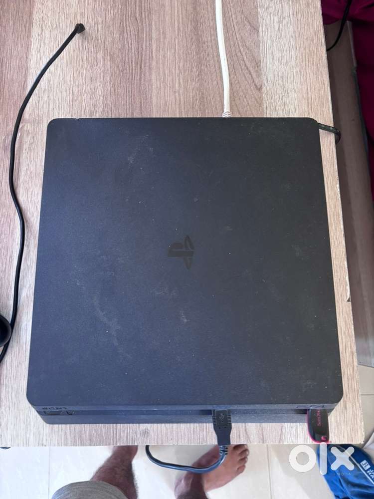 PS4 1TB Console with one wireless controller and 2 game discs