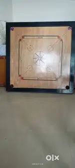 Used Golden carrom board with carrom coins for sale price Rs.850