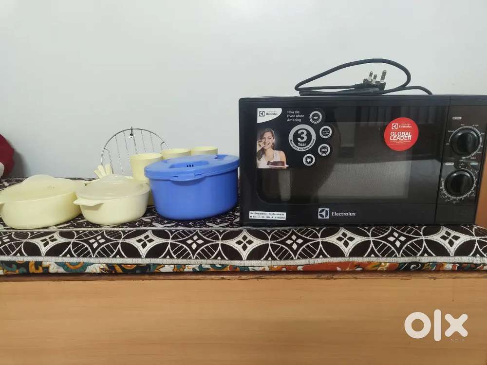 Electrolux microwave oven, specifically a black model with a grill