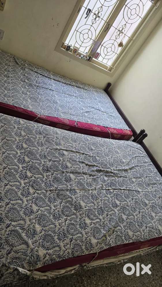 Steel cot with bed