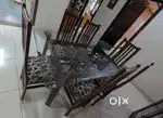 Teak wood dining table with glass top and 6 chairs.