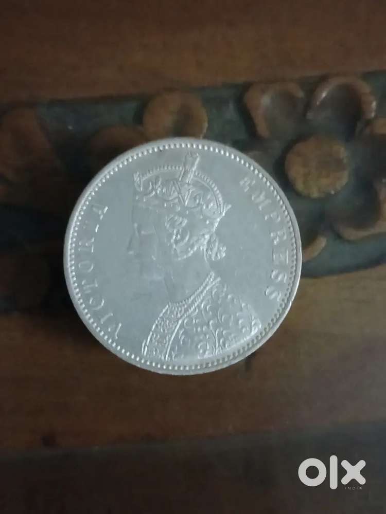 1877 Victoria Empress One Rupee Silver Coin in UNC/ Mint condition.