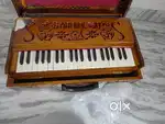 Brand new Harmonium with wooden cover for carrying