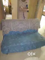 An old three seater sofa for sale