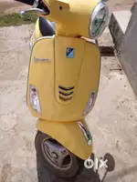 Yellow vespa bike for sale
