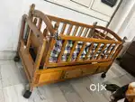 Polished Wooden Baby cot with swing in excellent condition