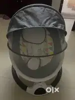 Babyhug electric swing cradle with mosquito net