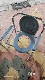 Easy foldable commode chair with wheels.
